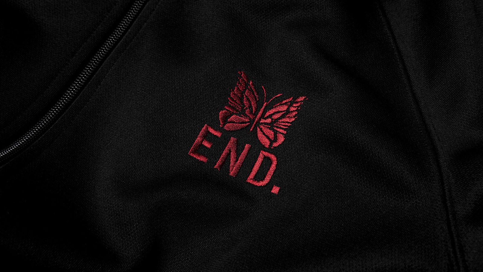 A model wears the END. x Needles track jacket