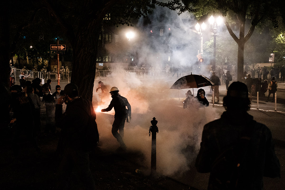 Federal officers use tear gas and other crowd dispersal munitions on protesters outside the Multnomah County Justice Cente