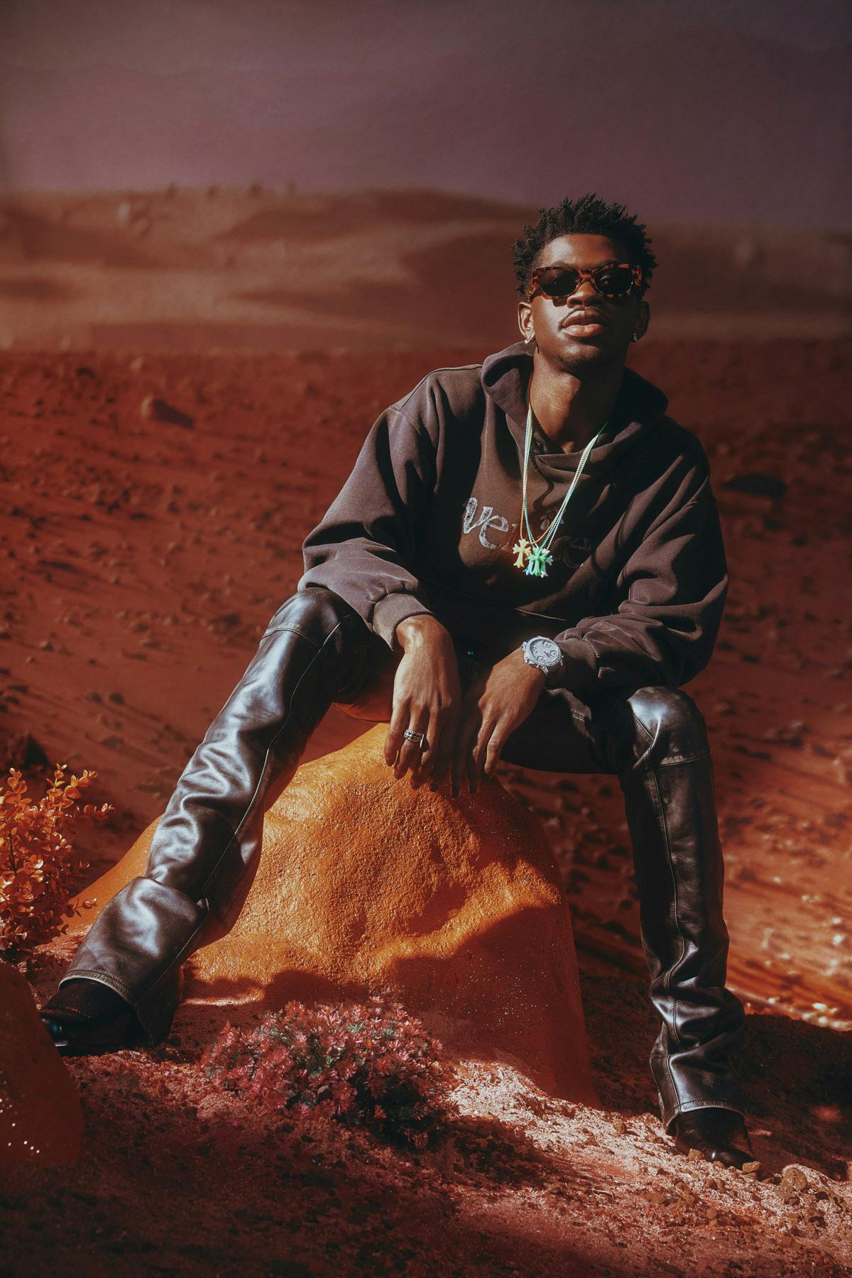 Hoodie ERL Pants DSQUARED2 Boots SUNNI SUNNI Watch and earrings JACOB & CO. Ring and necklaces CHROME HEARTS Sunglasses RETROSUPERFUTURE