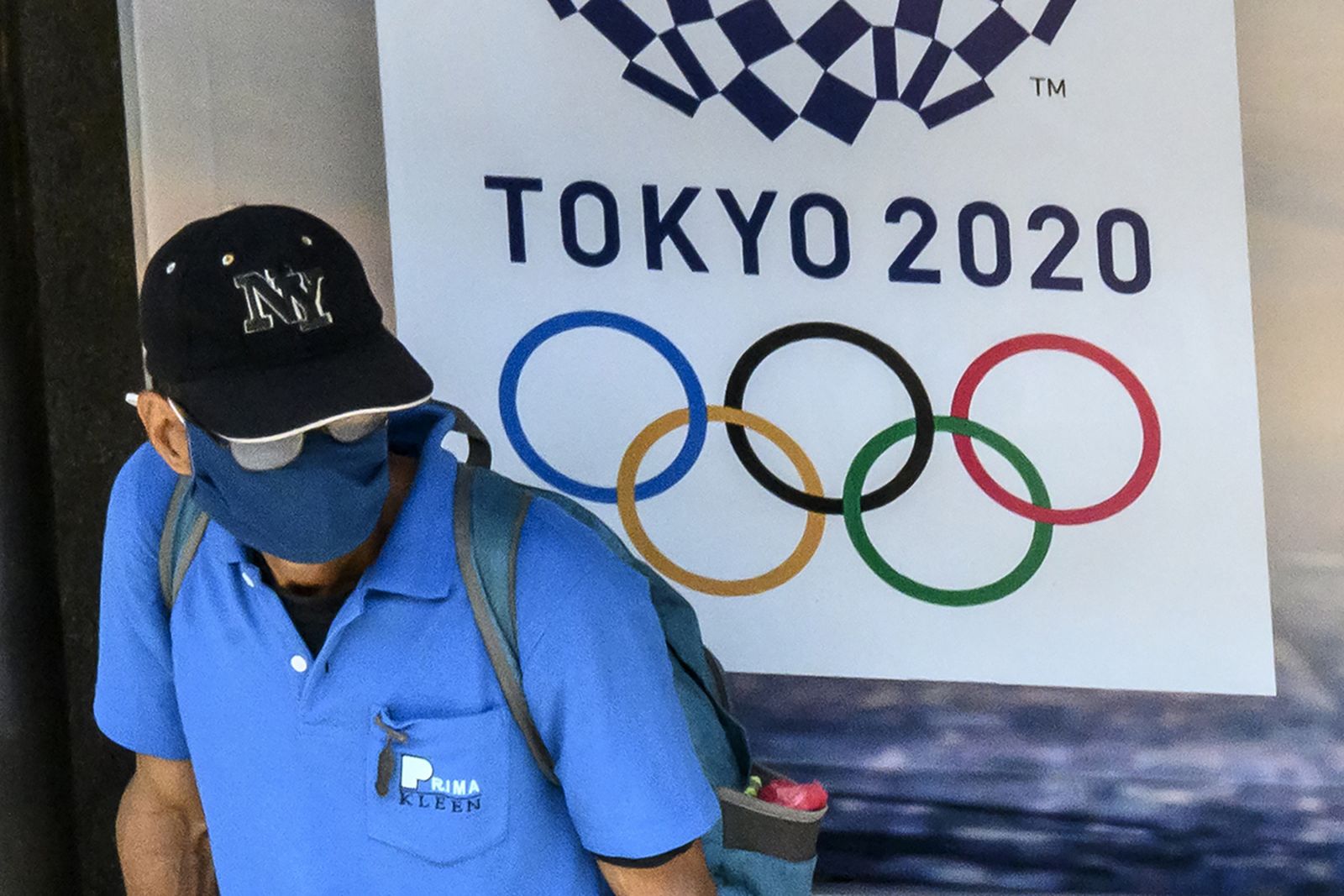 Tokyo 2020 Olympics sign man with mask