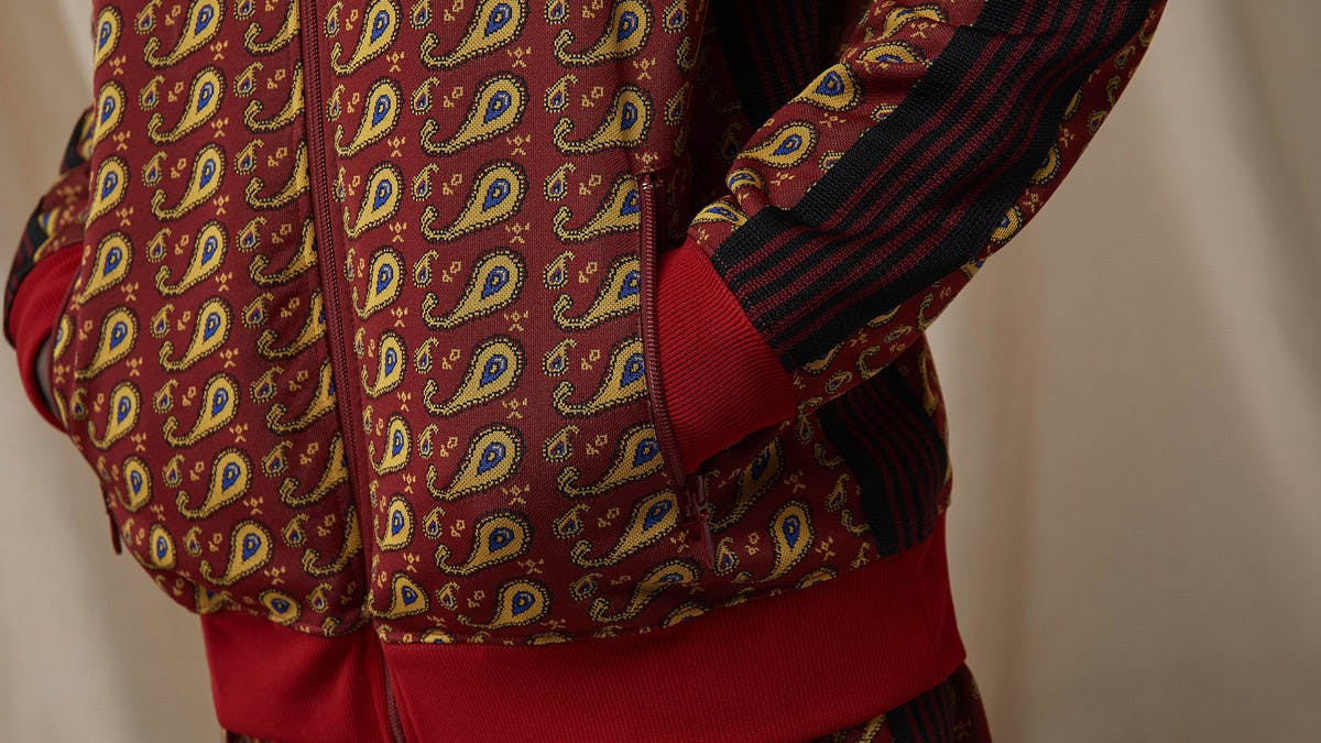 A model wears the END. x Needles track jacket