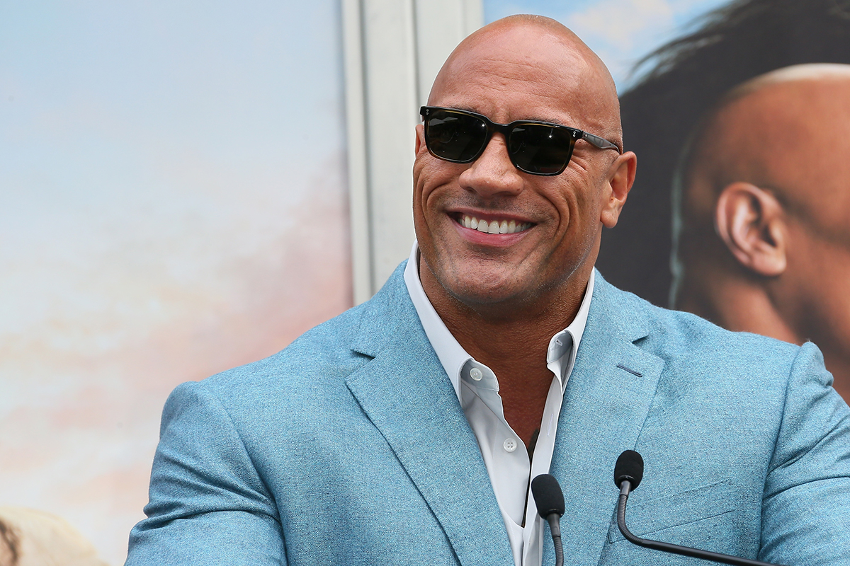Dwayne Johnson attends a Hand and Footprint ceremony honoring Kevin Hart