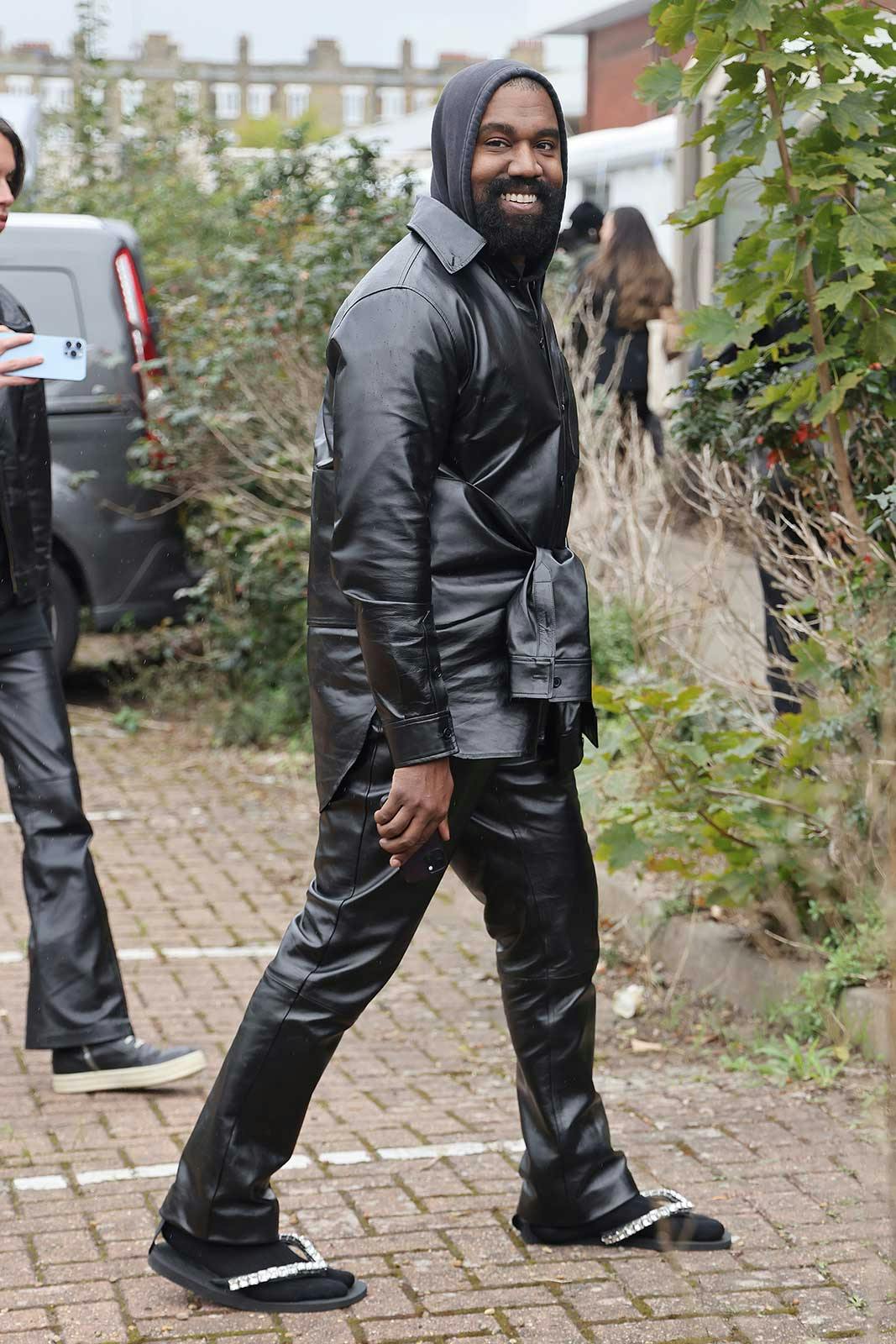 Kanye West’s Socks, Sandals & Leather Outfit Is Insanity