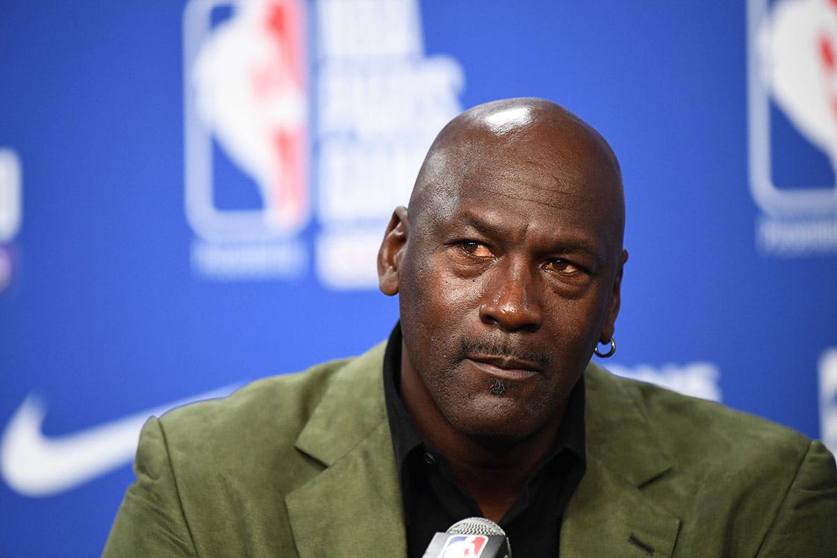 Former NBA star and owner of Charlotte Hornets team Michael Jordan looks on as he addresses a press conference ahead of the NBA basketball match between Milwaukee Bucks and Charlotte Hornets at The AccorHotels Arena in Paris on January 24, 2020. (Photo by FRANCK FIFE / AFP) (Photo by FRANCK FIFE/AFP via Getty Images)