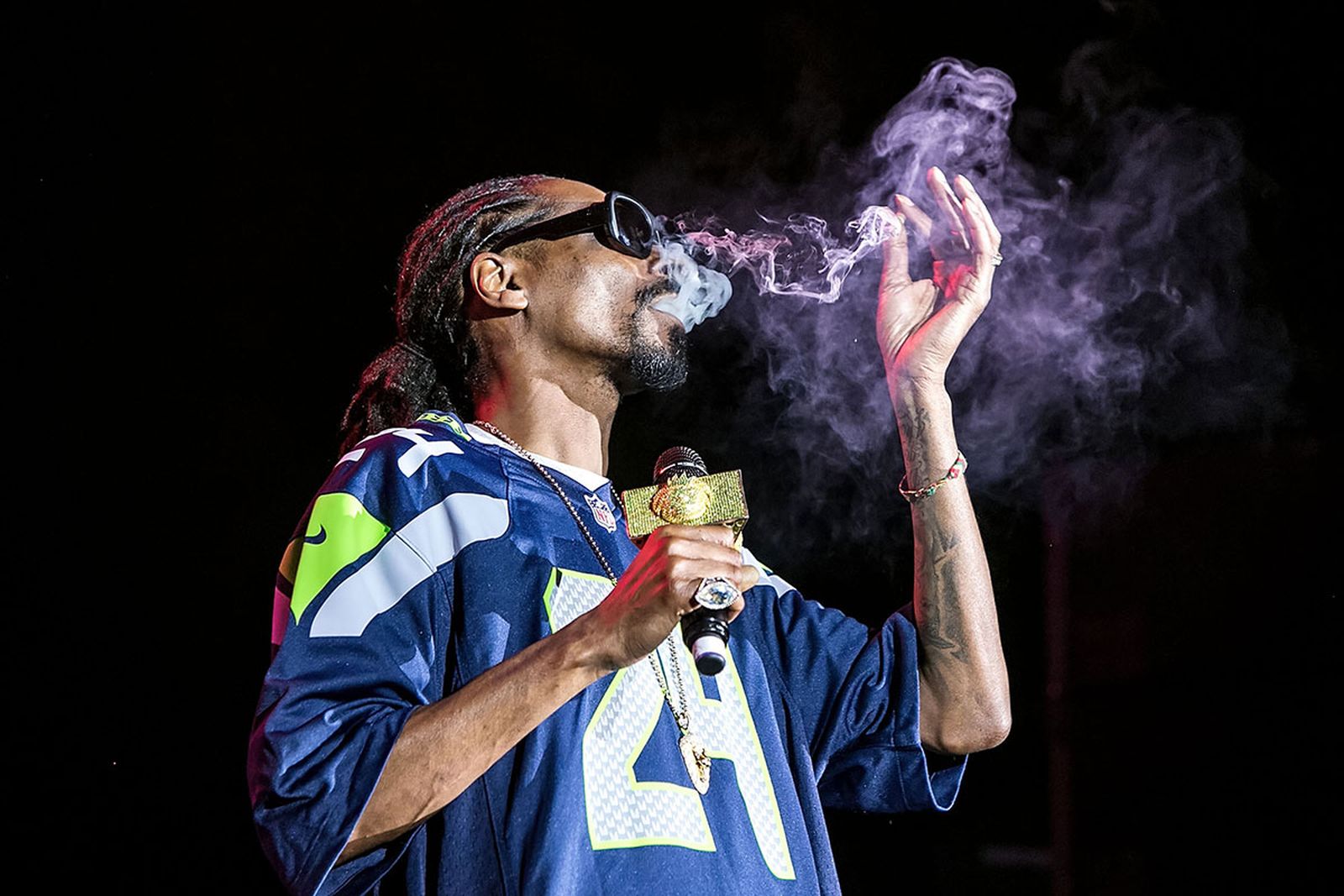 Snoop Dogg smokes a blunt on stage