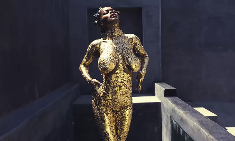 Teyana Wears Nothing But Gold Paint in "Champions"
