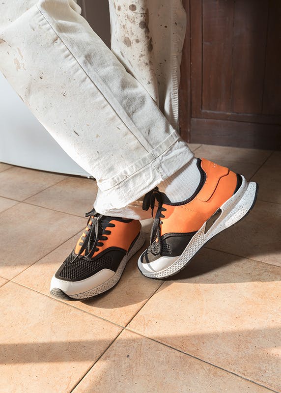 Alberto Panocchi wears vintage Dickies work pants and a Supreme t-shirt.