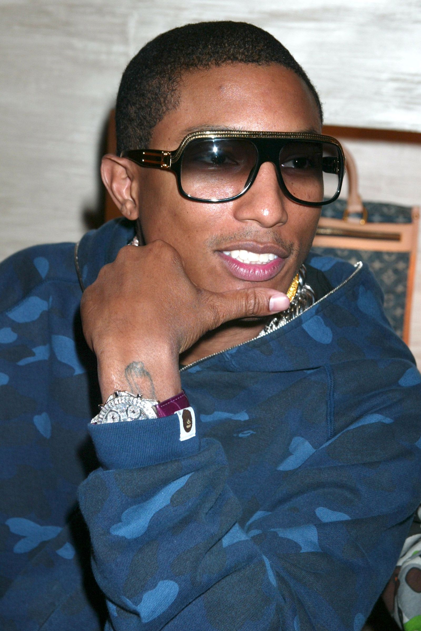 Pharrell Williams, wearing "The Millionaire" design from his line of sunglasses with Louis Vuitton.