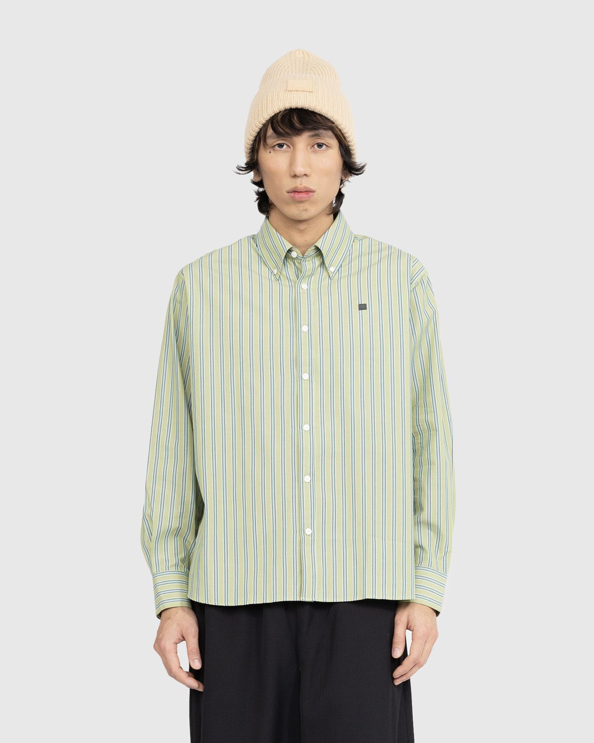 green and white button up shirt
