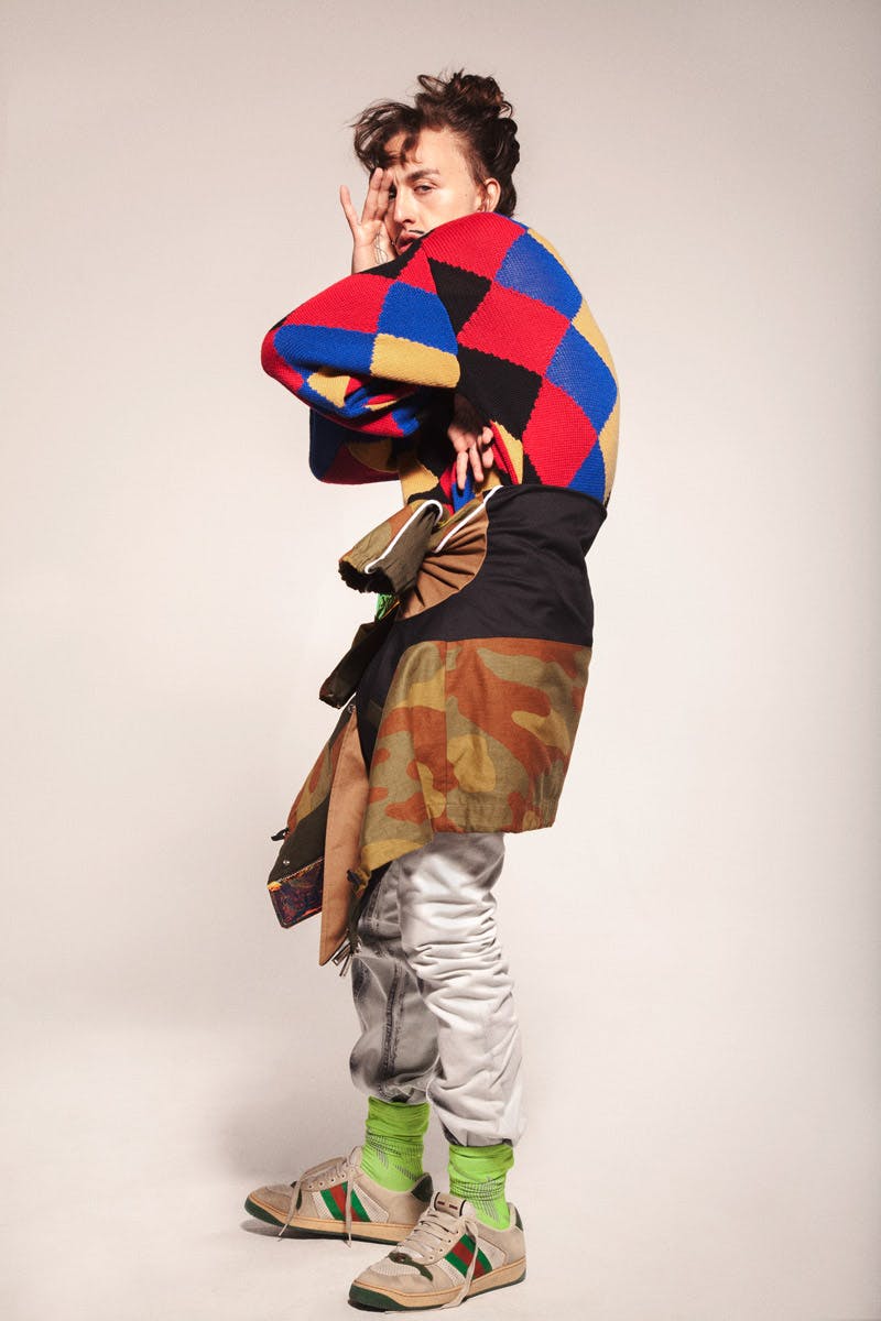 Knit jumper: Martine Rose, Jeans: John Lawrence Sullivan, Jacket: DSquared, Socks: Nike, Sneakers: Gucci