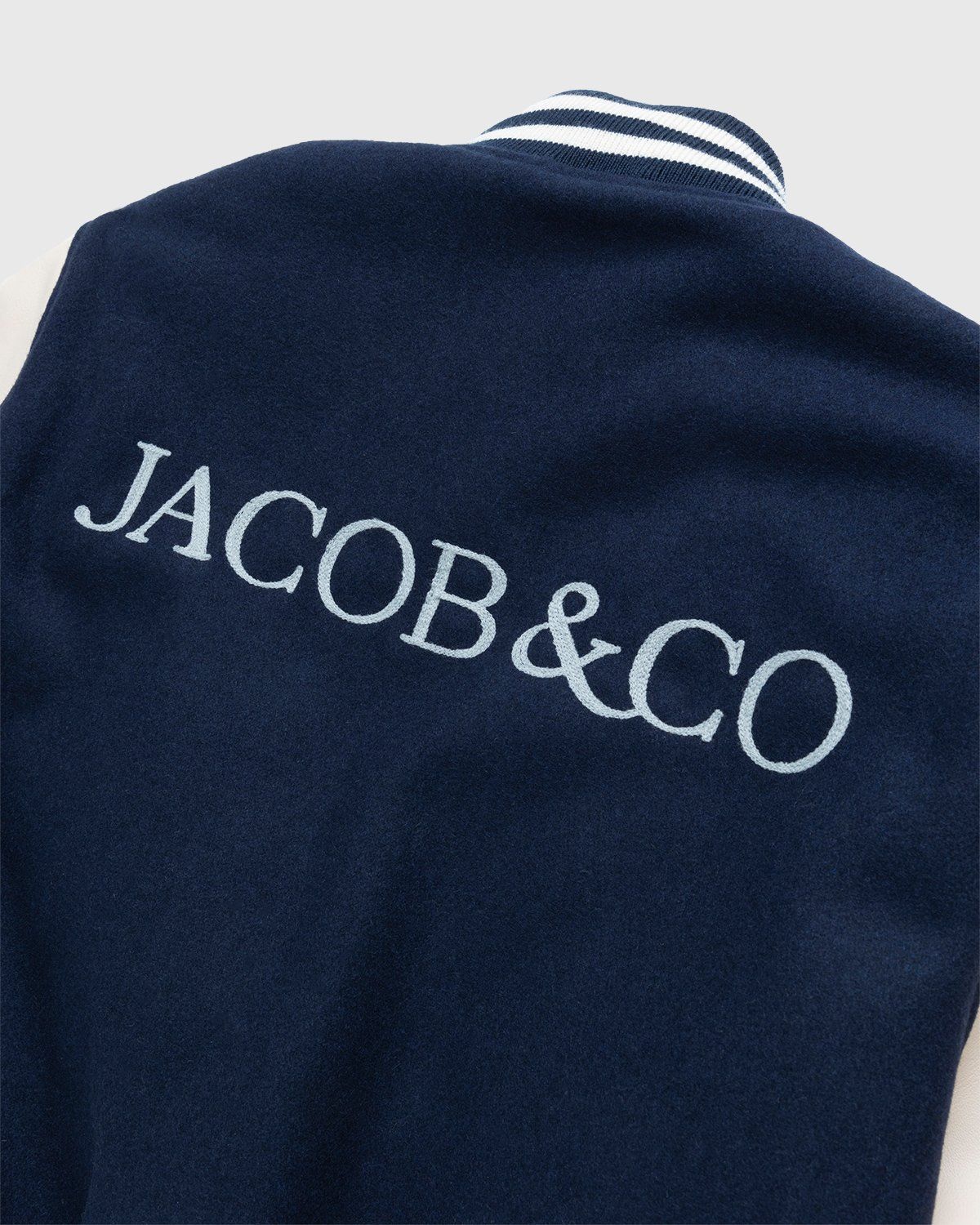 Jacob & Co. x Highsnobiety – Logo Varsity Jacket Navy Creme - Image 6