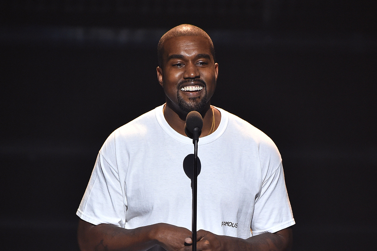Kanye West smiling white tee