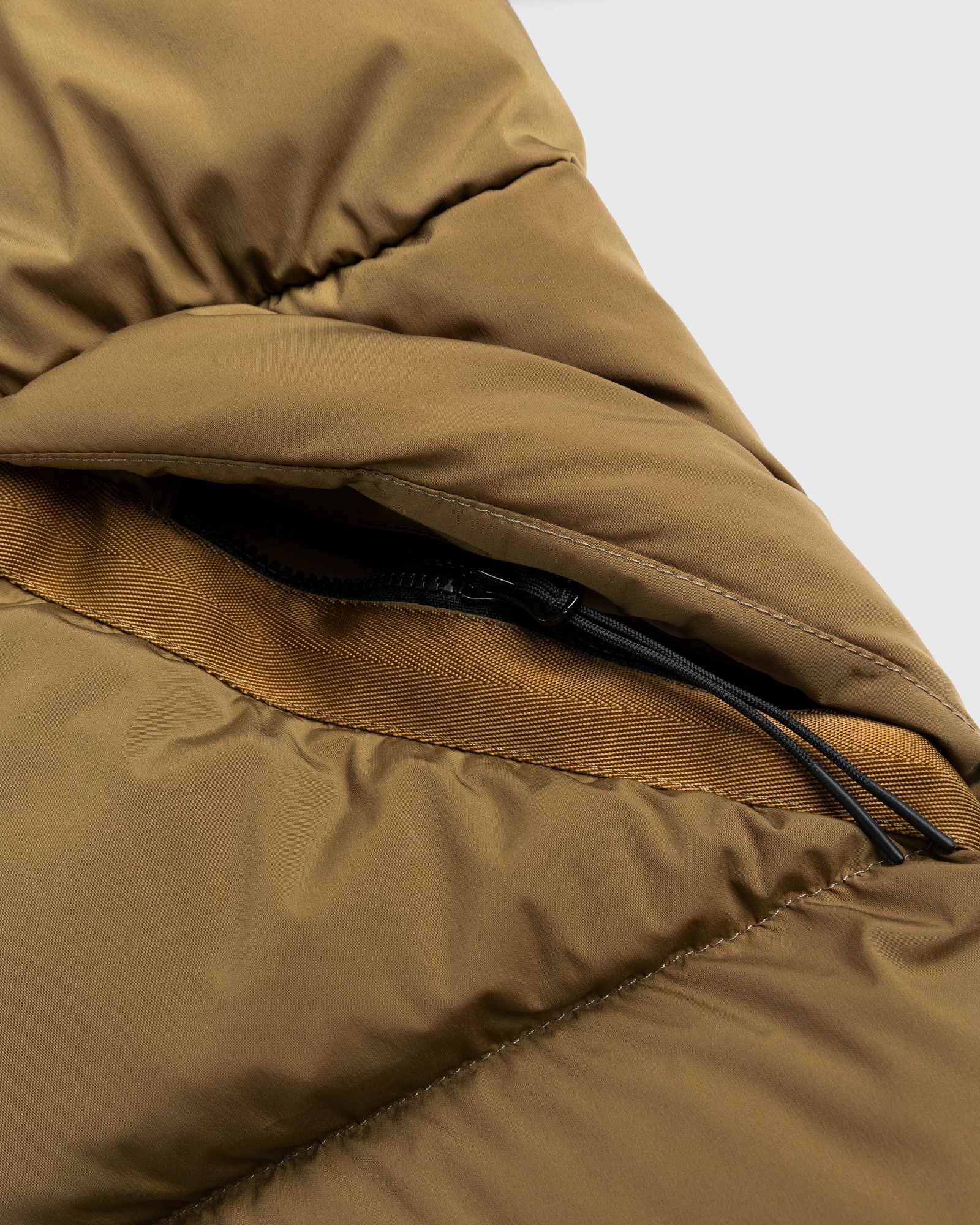 c-p-company-nycra-r-goggle-down-jacket-brown-highsnobiety-shop