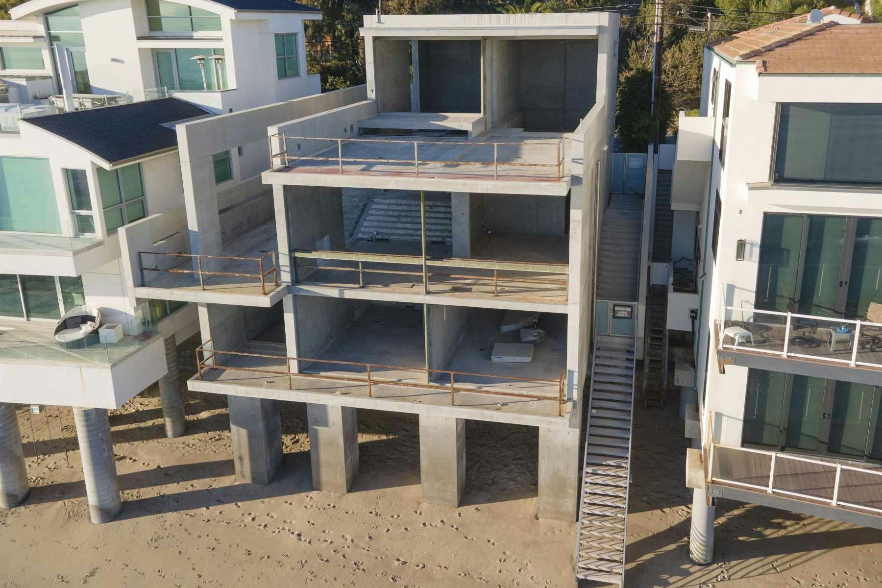 *EXCLUSIVE* After Kim Kardashian meeting with renowned architect Tadao Ando his Malibu designed oceanfront mansion owned by Kanye West shown barren and decaying