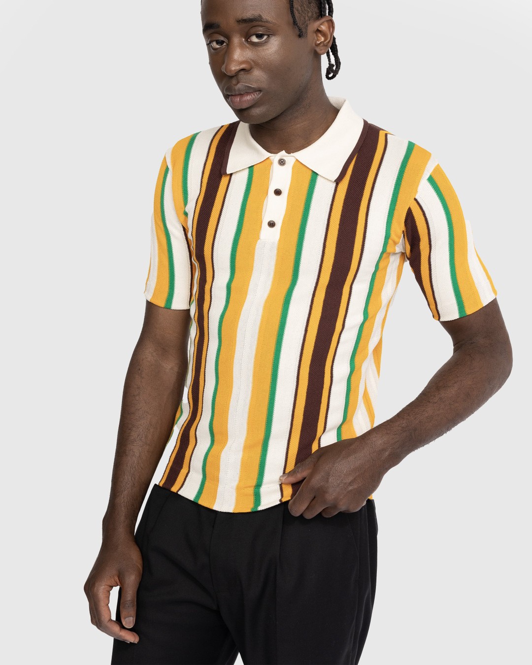 Black and yellow striped top polo shirt