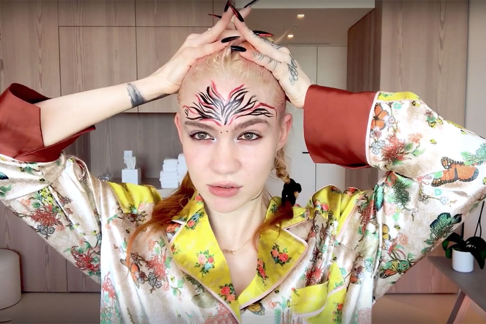Grimes does her makeup for vogue