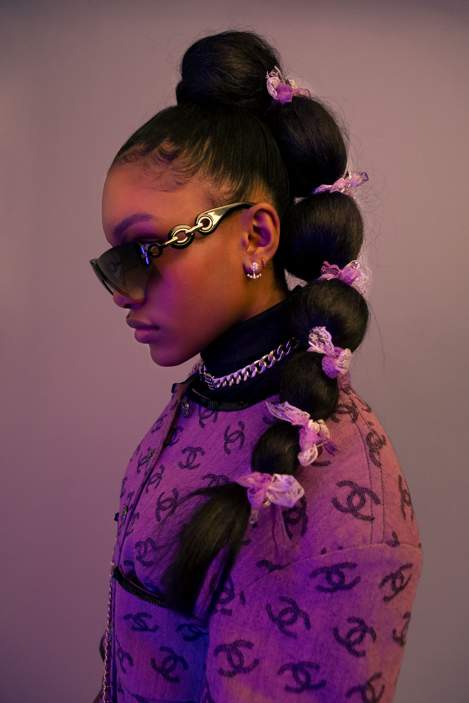 Turtleneck STYLIST’S OWN Dressand necklace CHANEL Sunglasses GIANT VINTAGE Left earring CARTIER Right earring DEMI’S OWN