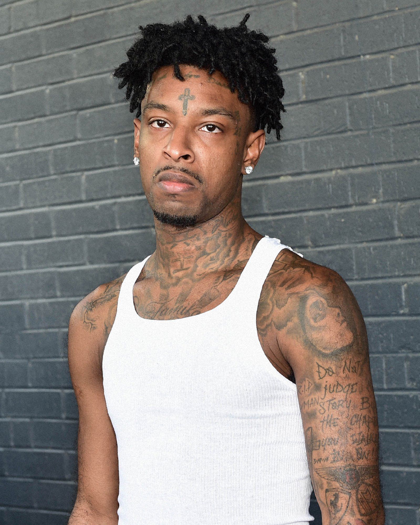 tattoos of rappers 21 Savage 50 cent Gucci Mane