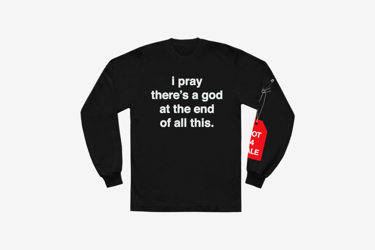 image of Andre' 3000's new sweater with slogan from tour jumpsuits