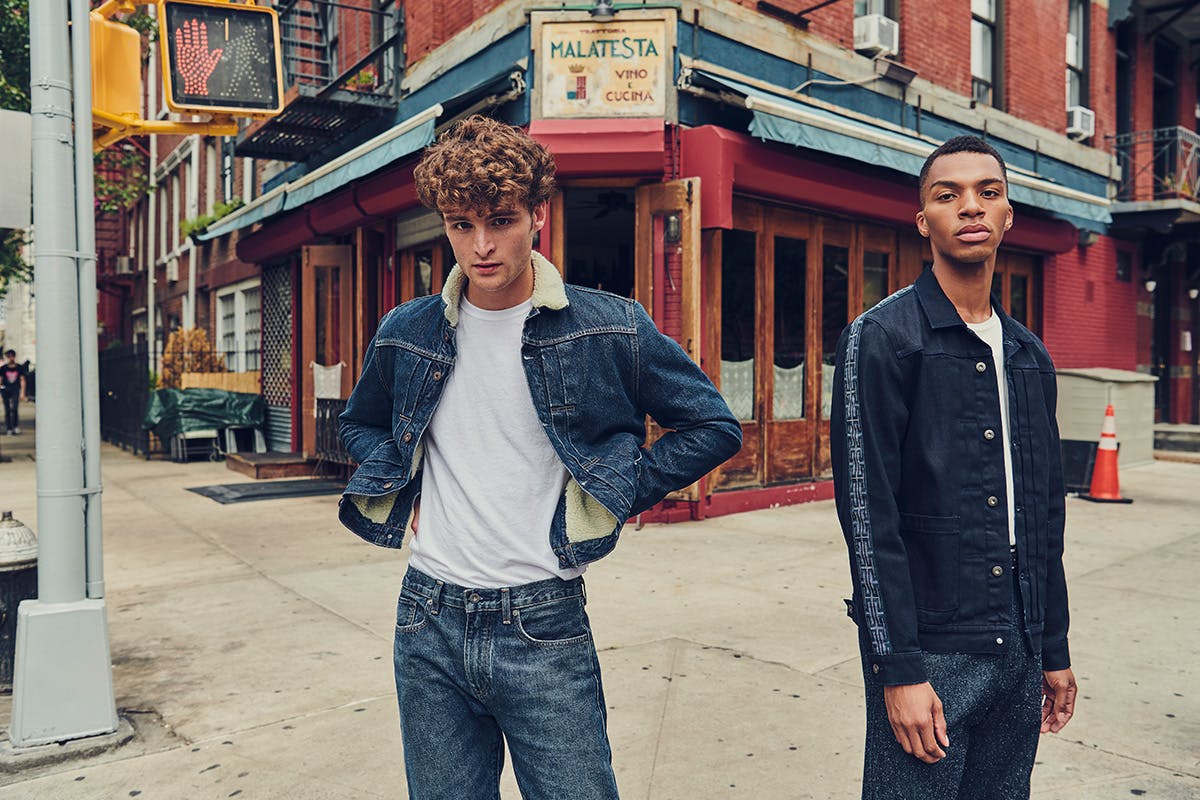 Left: Outerwear: Type II Sherpa Jacket in Canyon Top: 8 OZ Tee in Bright White Bottom: 502 Regular Taper Jean in Cork Right: Outerwear: Type II Worn Trucker in Blue Black Top: 8 OZ Tee in Bright White Bottom: Taper Trouser in Neppy Denim Blues   