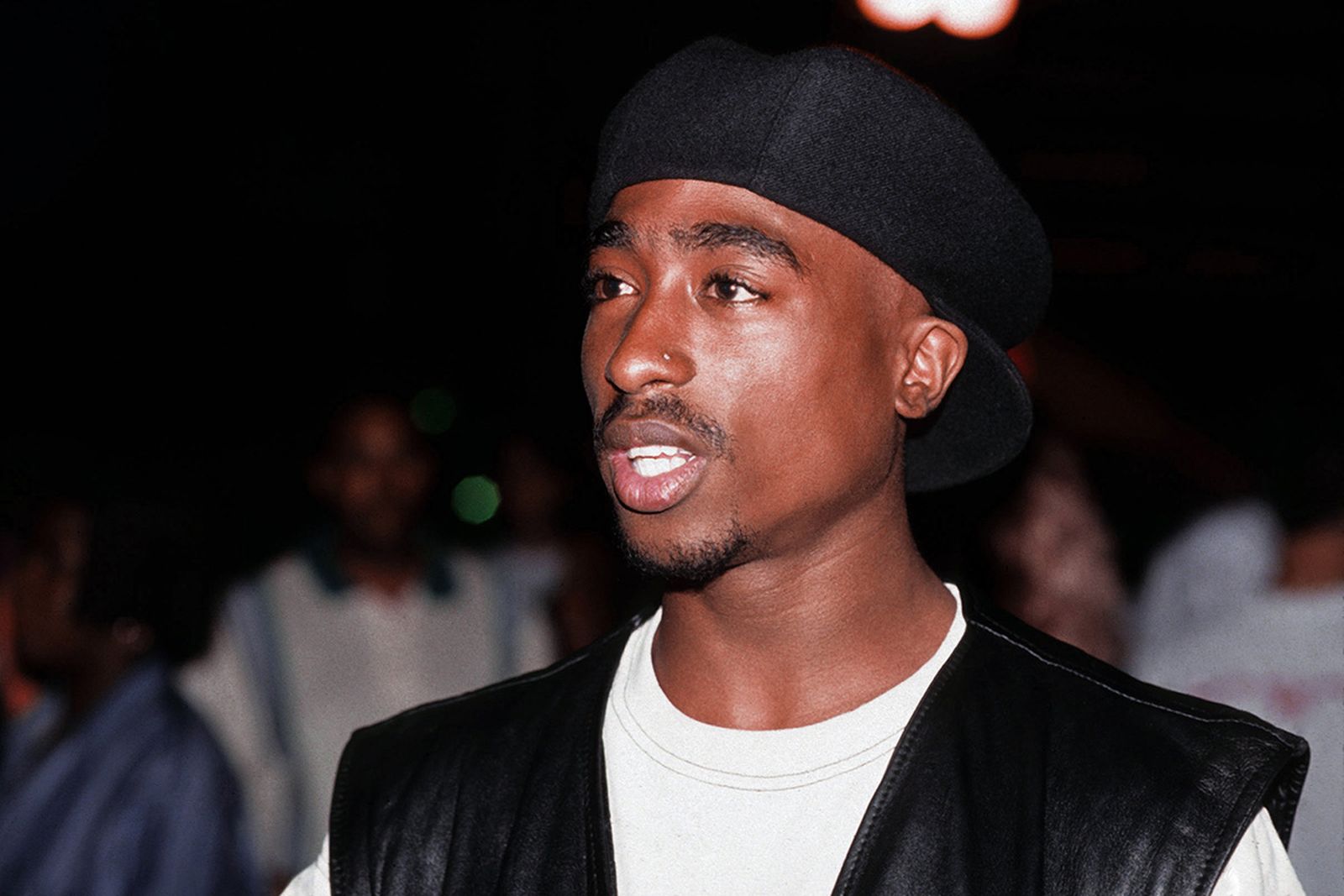 Tupac Shakur poses for a portrait at Club Amazon