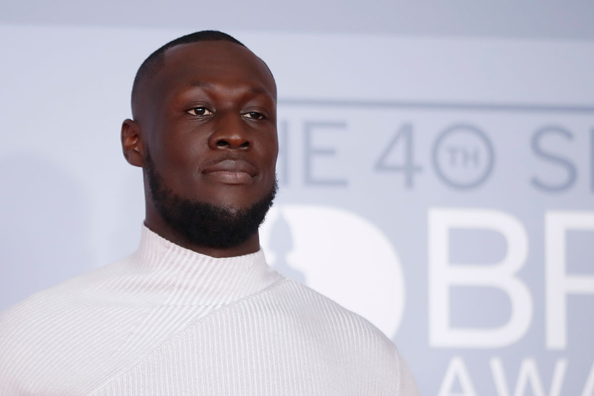 Stormzy poses on the red carpet on arrival for the BRIT Awards 2020