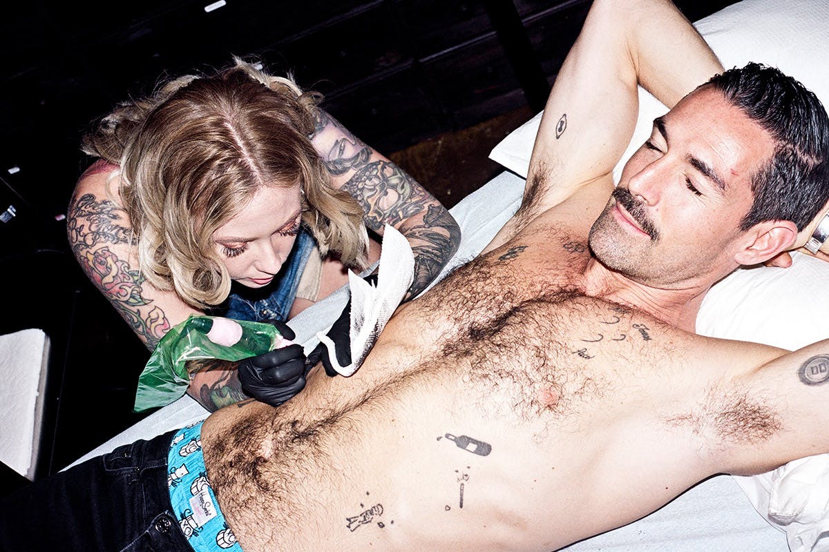 Happy Socks founder Mikael Söderlindh getting tattooed by Megan Massacre in New York
