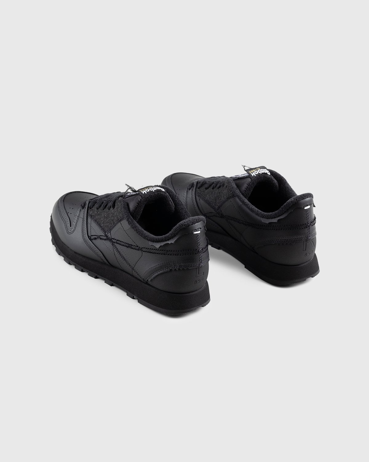 All black reebok shoes sales