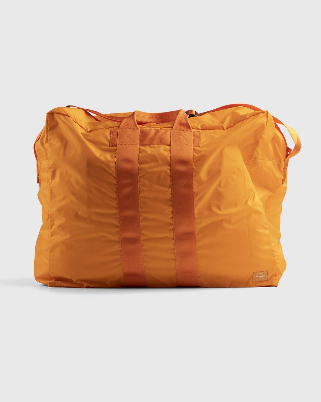 Porter-Yoshida & Co. – Flex 2-Way Duffle Bag Orange - Duffle & Top Handle Bags - Orange - Image 1