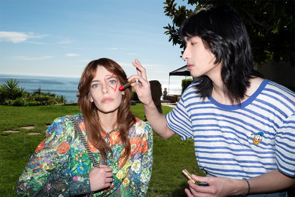 Gucci Valentines Fanzine man drawing heart around woman's eye