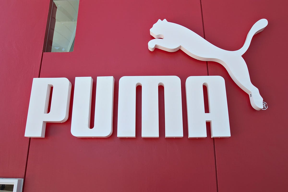 puma best ever quarter sales profit Adidas Nike