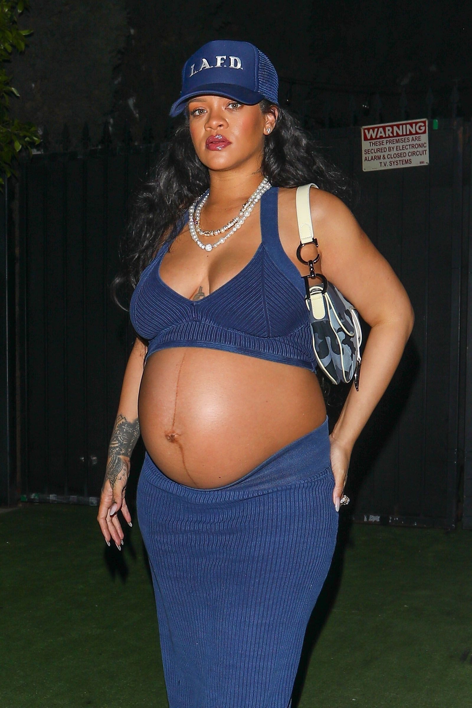 Rihanna shows off her huge bulging belly as she leaves after dinner at Nobu