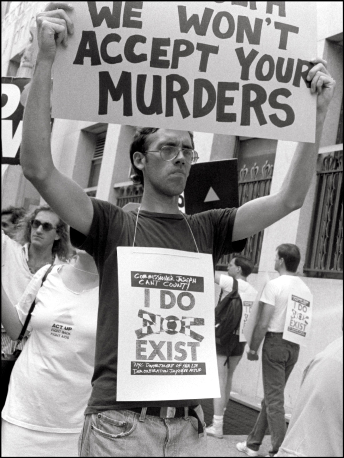 David Wojnarowicz of ACT UP demonstrates outside the offices of the New York City Commissioner of Health, 1988