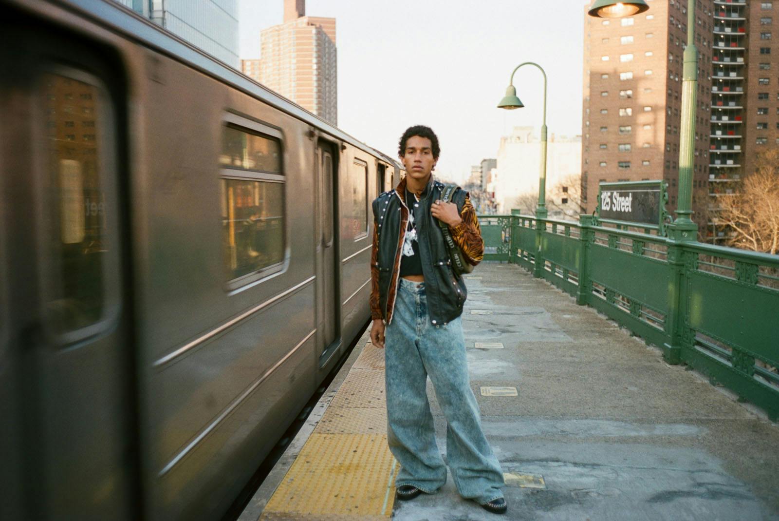 Top, pants, jacket, vest, necklace and shoes CELINE HOMME BY HEDI SLIMANE Medium Trekking Ava Bag in Cotton Gabardine Khaki CELINE HOMME BY HEDI SLIMANE Earrings and ring MYLES’S OWN