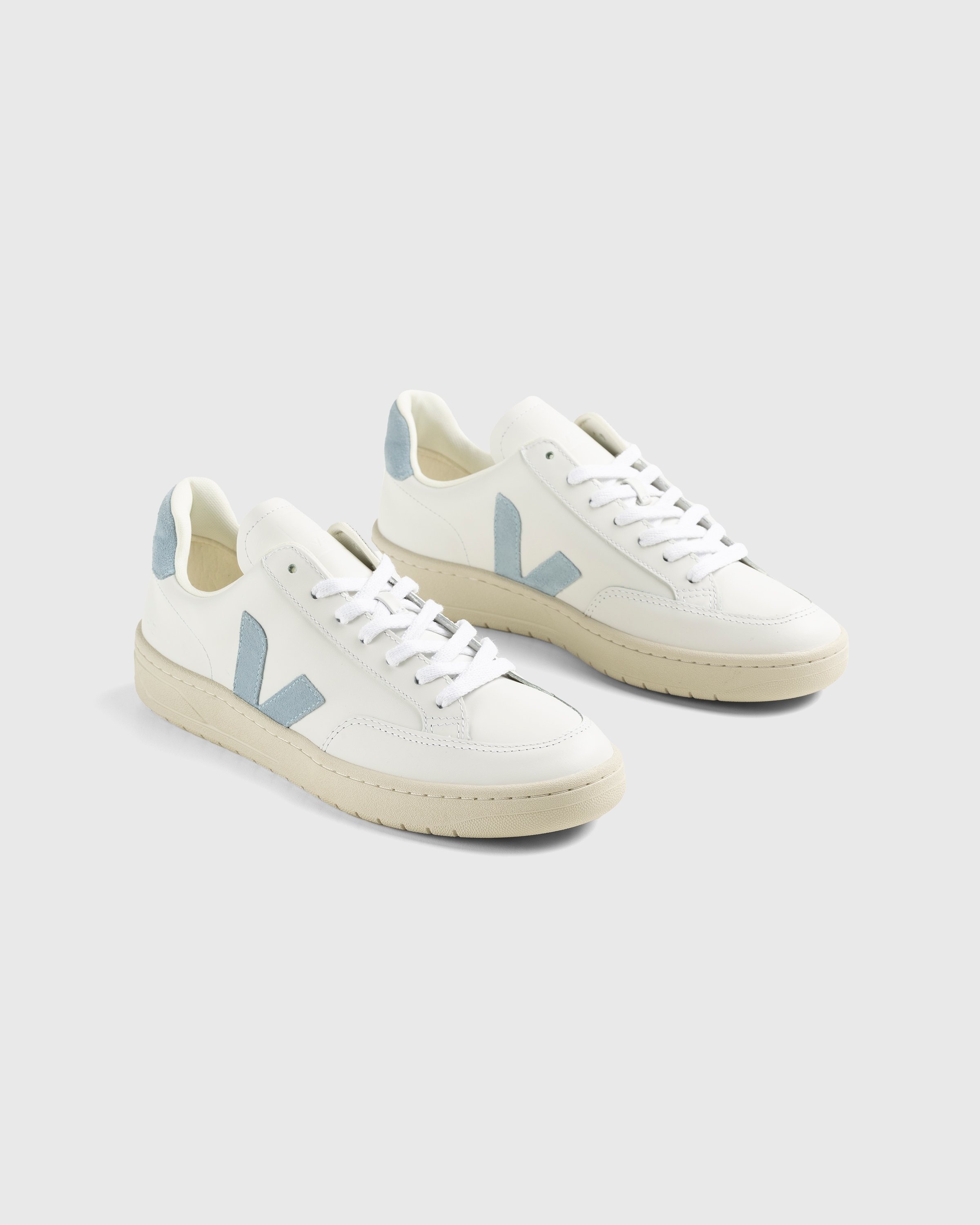 White sneakers with v on the side outlet
