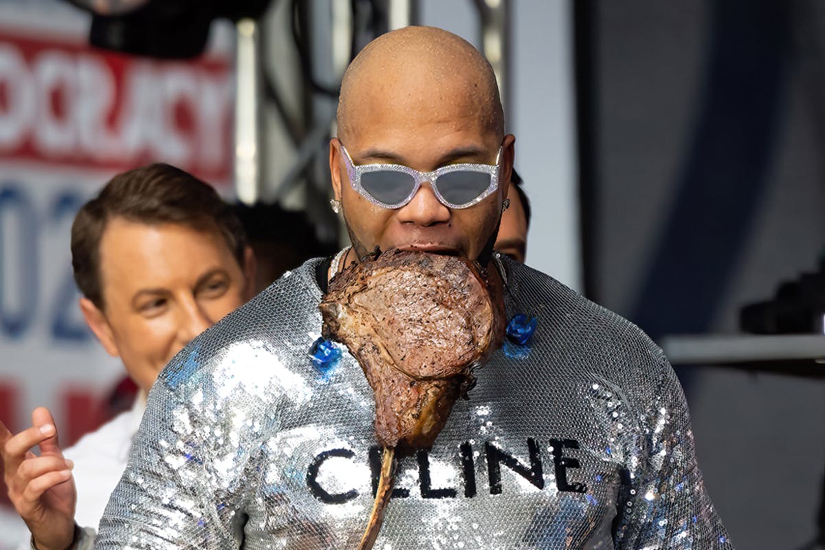 Flo Rida Wears $2k CELINE Shirt While Eating Steak Onstage