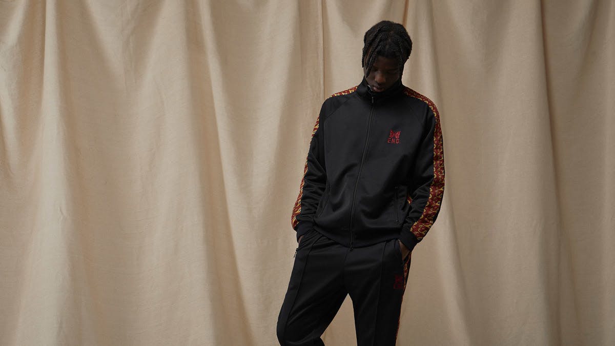 A model wears the END. x Needles track jacket