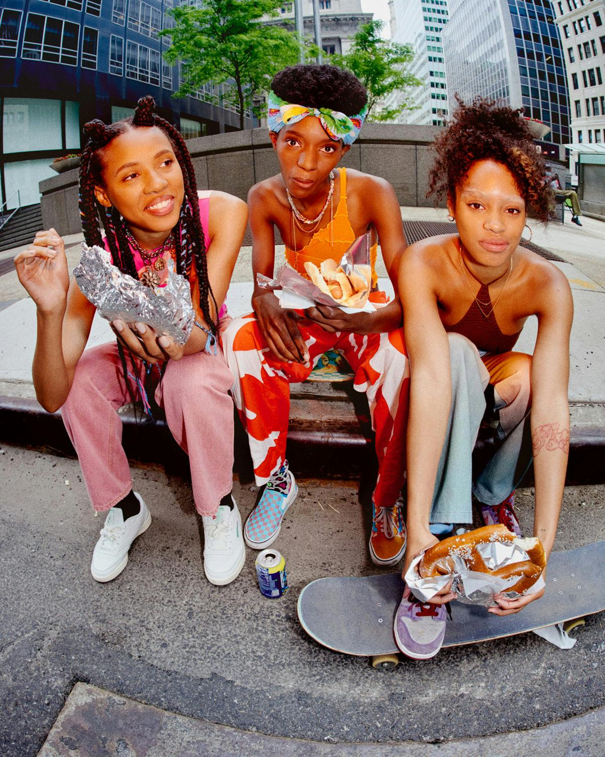Moonbear wears Top SHERRIS, Pants BODE, Necklace JUSTINE CLENQUET, Necklace BISOUS BEADS, Shoes MODEL’S OWN. Dede wears Top TYLER MCGILLIVARY, Pants GANNI, Necklace CHOPOVA LOWENA, Shoes MODEL’S OWN. Ajani wears Top HEAVEN BY MARC JACOBS, Pants PRISCAVERA, Shoes MODEL’S OWN.