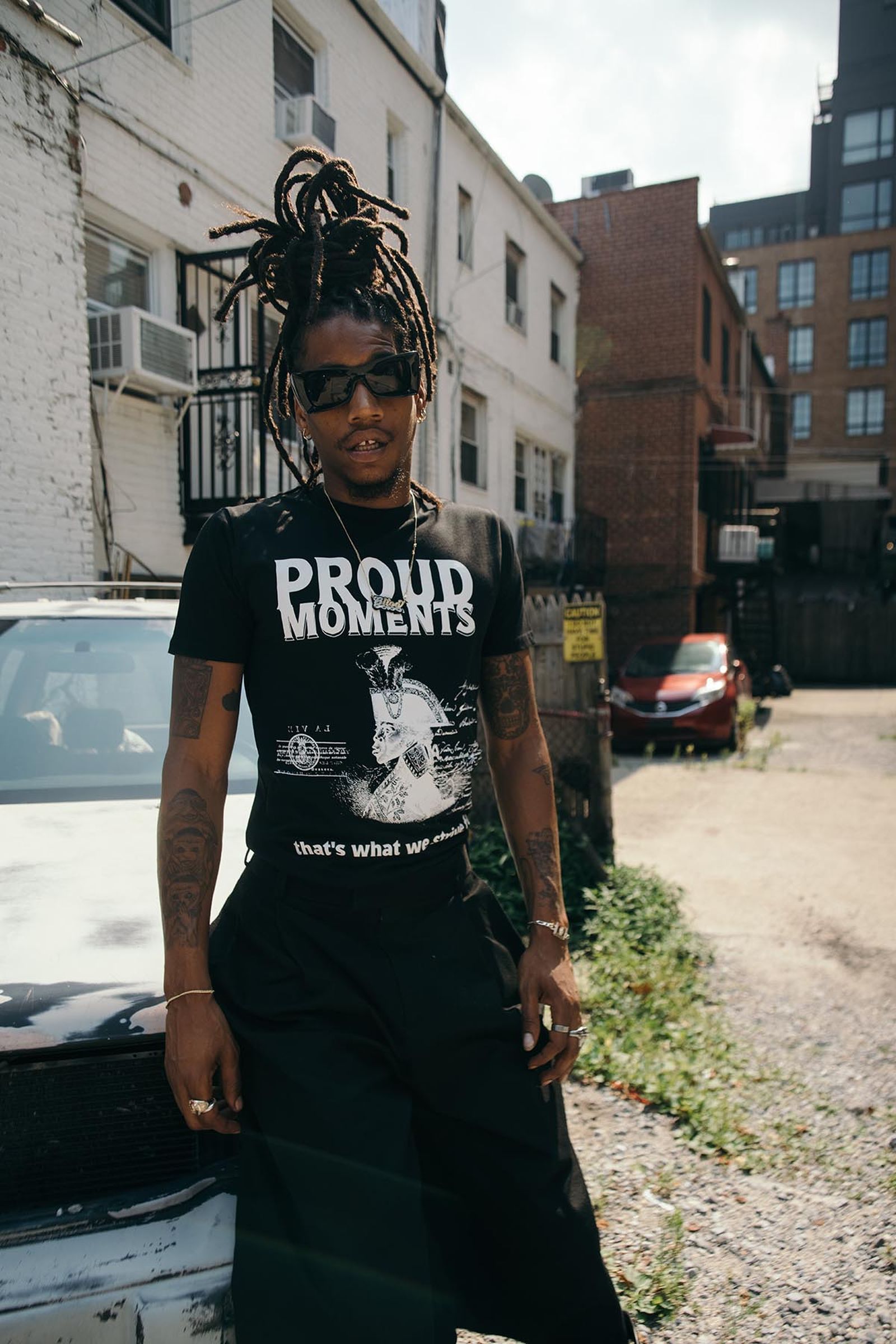 Jorge Gitoo Wright wears the 'Proud Moments' tee from the SNIPES Juneteenth collection.