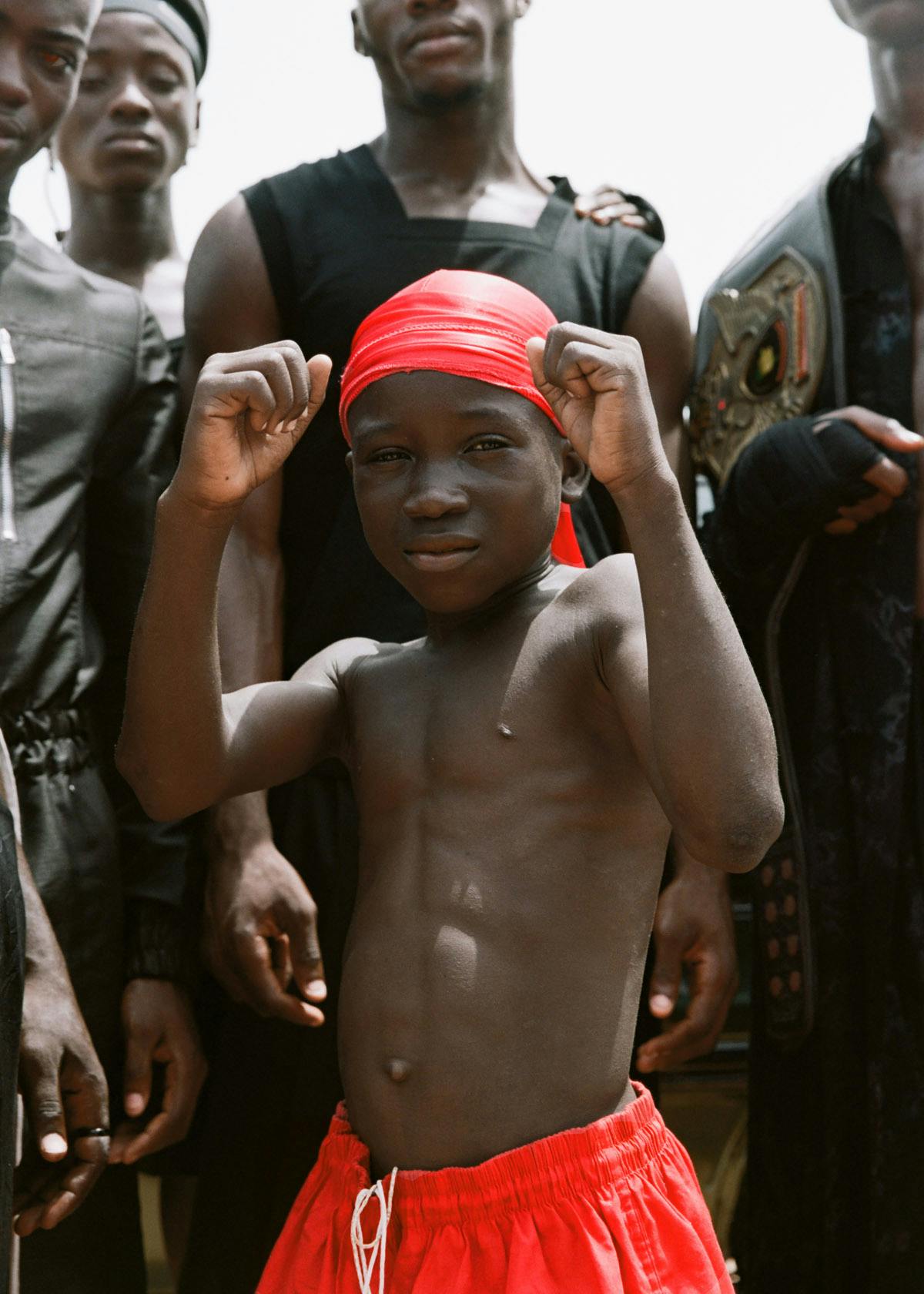 ROBERT TAGOE Jumpsuit RICK OWENS KID Shorts and durag STYLIST’S OWN PHILIP ESHUN Tank top and shorts BURBERRY
