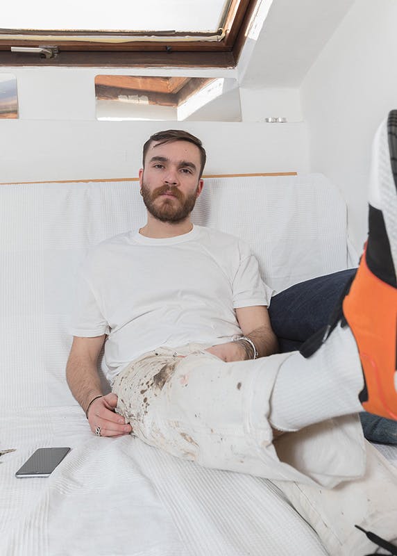 Alberto Panocchi wears vintage Dickies work pants and a Supreme t-shirt.