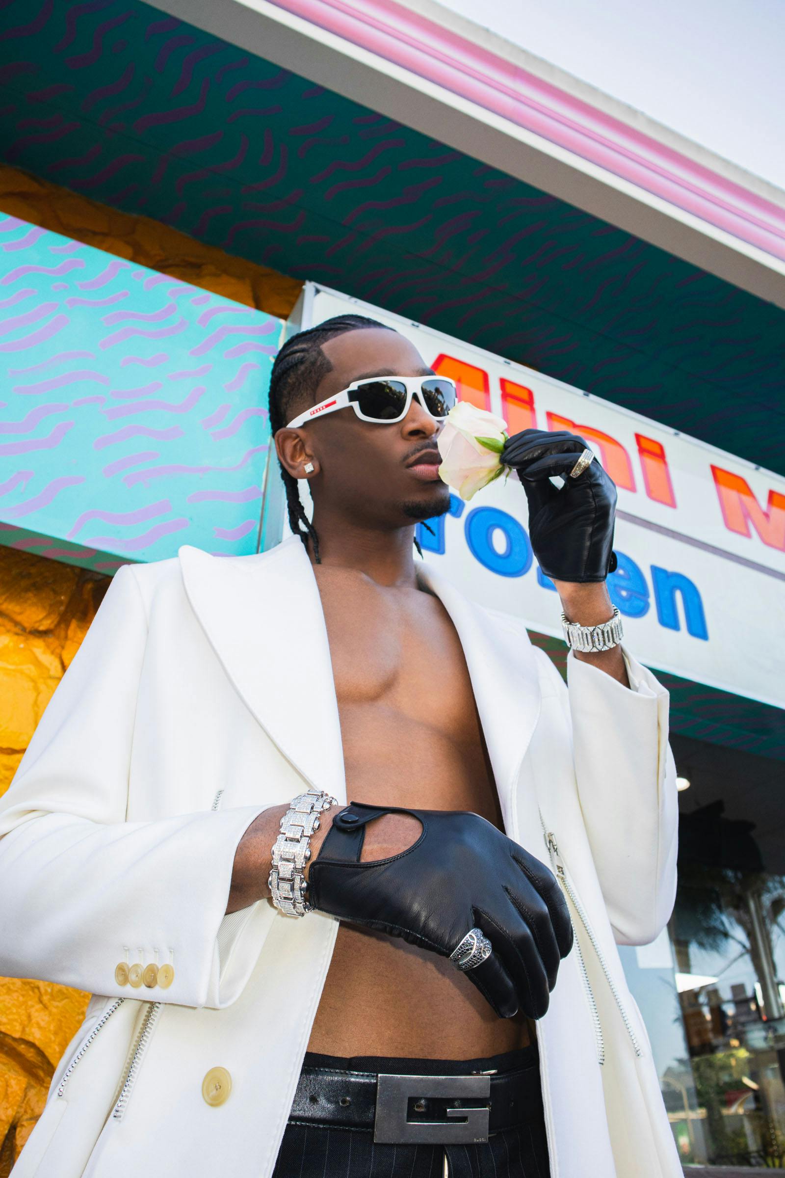 Coat ALEXANDER MCQUEEN Pants BERLUTI Sunglasses PRADA SPORT Earring SHAI’S OWN Gloves SEYMOURE GLOVES Bracelets JACOB & CO. Rings DAVID YURMAN Belt ARCHIVE GUCCI, STYLIST’S OWN