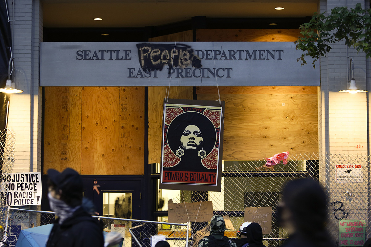 An image of activist Angela Davis is displayed above the entrance to the Seattle Police Department