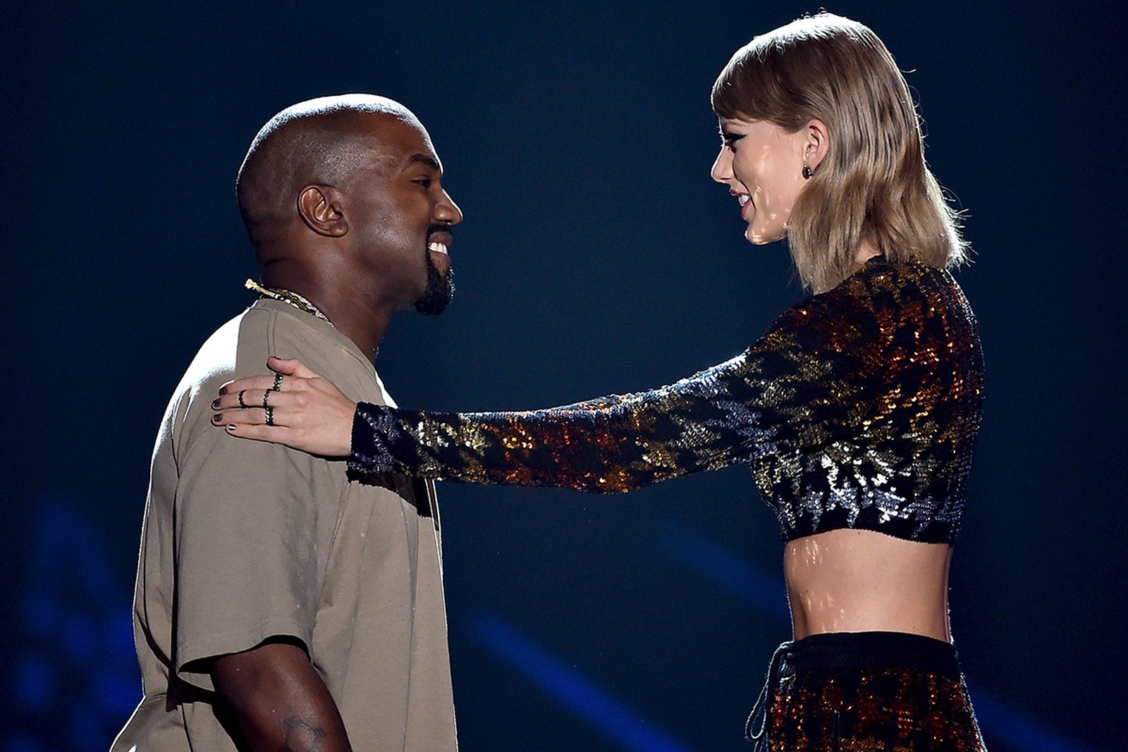 Kanye West accepts the Video Vanguard Award from recording artist Taylor Swift