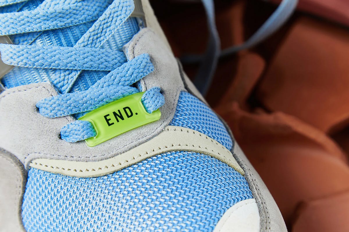 The END. x adidas Originals ZX 9000 collaborative sneaker in blue, grey, and terracotta colors.