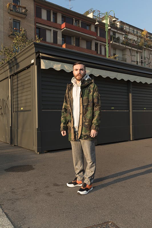 Alberto Panocchi wears Matteo Lamandini Studio pants, a Fuct sweatshirt and a vintage military parka.