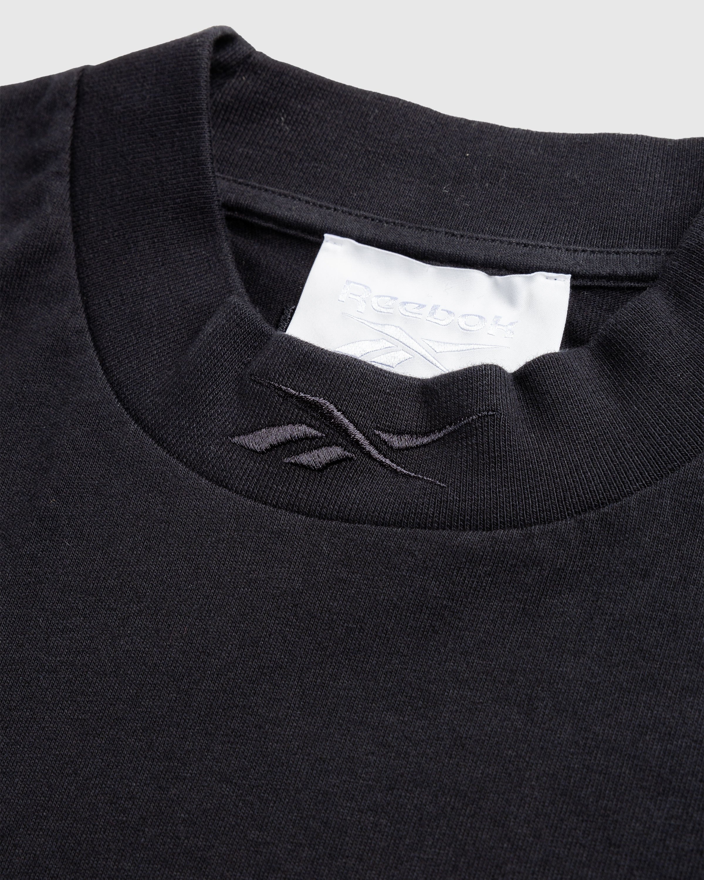 Black reebok hot sale shirt