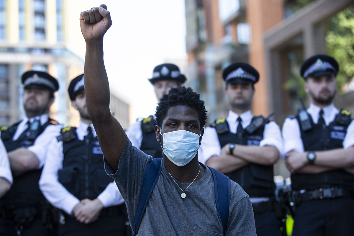 people join in a spontaneous Black Lives Matter march through central London to protest the death of George Floyd
