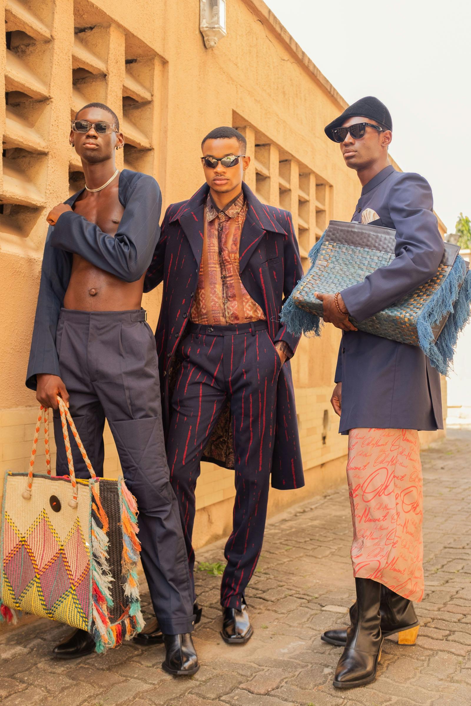 Miracle wears jacket and pants TJ WHO Bag AWA MEITE Sunglasses and necklace STYLIST’S OWN Shoes LA RUE Dayo wears shirt, jacket and pants RICK DUSI Sunglasses STYLIST’S OWN Shoes LA RUE Chuka wears jacket and pants ODIO MIMONET Hat and sunglasses STYLIST’S OWN Shoes LA RUE